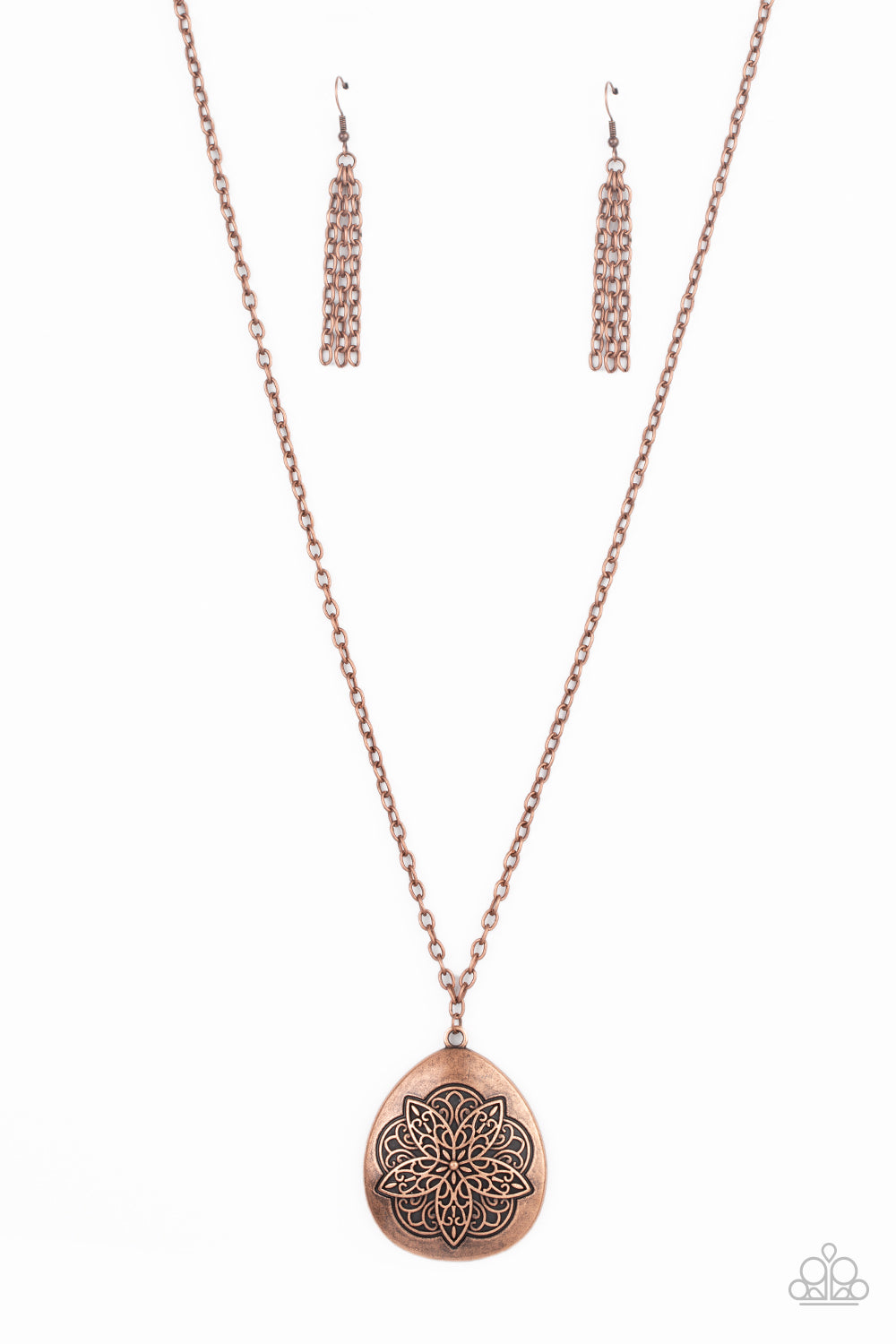 Embossed in a flowery mandala-like pattern, an asymmetrical copper teardrop frame swings from the bottom of a lengthened copper chain for a rustic flair. Features an adjustable clasp closure. 
