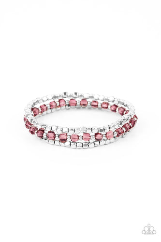 Separated by dainty silver beads, a sparkly strand of square purple crystal-like beads joins a pair of silver cube beaded stretchy bands around the wrist for a colorful look.