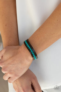  A colorful row of blue hearts is stitched across the front of a dainty brown leather band. Features an adjustable snap closure.