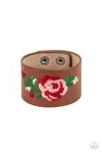 Load image into Gallery viewer, A leafy rose is embroidered across the center of a thick leather band, adding a hint of girly girl glam to the seasonal centerpiece. Features an adjustable snap closure.
