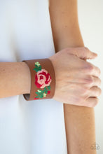 Load image into Gallery viewer, A leafy rose is embroidered across the center of a thick leather band, adding a hint of girly girl glam to the seasonal centerpiece. Features an adjustable snap closure.
