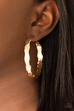 Load image into Gallery viewer, Featuring raw, scalloped edges, a hammered gold hoop curls around the ear for an electrifying look. Earring attaches to a standard post fitting. Hoop measures approximately 2 1/4&quot; in diameter.
