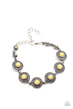 Load image into Gallery viewer, Dotted with sunny Illuminating beaded centers, dainty floral embossed silver frames delicately link around the wrist for a colorful springtime look. Features an adjustable clasp closure.
