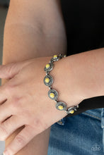 Load image into Gallery viewer, Dotted with sunny Illuminating beaded centers, dainty floral embossed silver frames delicately link around the wrist for a colorful springtime look. Features an adjustable clasp closure.
