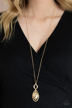 Load image into Gallery viewer, A golden marquise cut rhinestone pendant swings from the top of an airy gold frame that interconnects with a series of mismatched gold links at the bottom of a lengthened gold chain for an elegant finish. Features an adjustable clasp closure.
