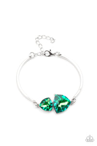 Featuring raw gem cuts, a pair of iridescent rhinestones connect to dainty silver bars around the wrist, creating a stellar cuff-like bracelet. Features an adjustable clasp closure.
