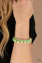 Load image into Gallery viewer, Dainty silver beads and mismatched green stone beads are threaded along stretchy bands around the wrist, creating vivacious layers.
