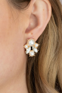 Featuring glistening gold fittings, a royal collection of bubbly pearls and glassy marquise white rhinestones delicately cluster into an elegant frame. Earring attaches to a standard post fitting.