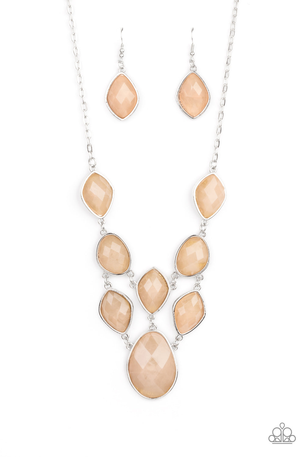 Featuring faceted surfaces, an asymmetrical collection of cloudy Desert Mist faux stone beads are pressed into sleek silver frames as they link into a mystical netted display below the collar. Features an adjustable clasp closure.