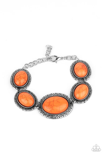 Stamped in dotted sunburst patterns, oval orange stone encrusted silver frames delicately link around the wrist for a colorful southwestern flair. Features an adjustable clasp closure