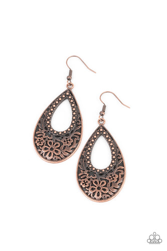 Featuring an airy studded center, the thickened bottom of an antiqued copper teardrop is embossed in a flowery pattern for a whimsical flair. Earring attaches to a standard fishhook fitting.