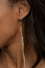 Load image into Gallery viewer, Sections of glassy white rhinestones attach to dainty gold rectangular rods, creating a statement-making tassel. Earring attaches to a standard fishhook fitting.
