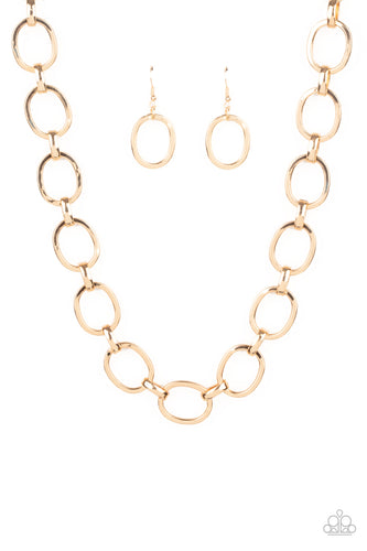 A glistening series of dramatically oversized ovals and links boldly connect below the collar, creating an intense industrial statement. Features an adjustable clasp closure.