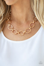 Load image into Gallery viewer, A glistening series of dramatically oversized ovals and links boldly connect below the collar, creating an intense industrial statement. Features an adjustable clasp closure.
