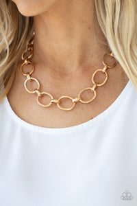 A glistening series of dramatically oversized ovals and links boldly connect below the collar, creating an intense industrial statement. Features an adjustable clasp closure.