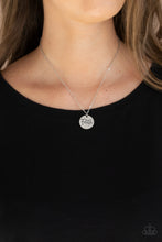 Load image into Gallery viewer, A dainty silver disc is stamped in the word, &quot;Faith,&quot; at the bottom of a shiny silver chain, creating an inspiring pendant below the collar. Features an adjustable clasp closure. 
