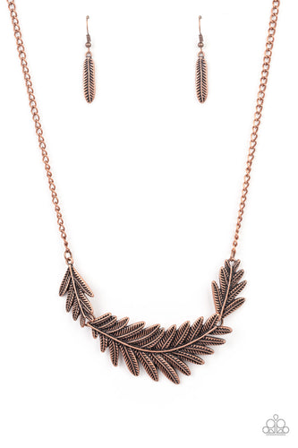 Etched and embossed in lifelike textures, leafy copper plates connect into a dramatic feather below the collar for a seasonal statement. Features an adjustable clasp closure.