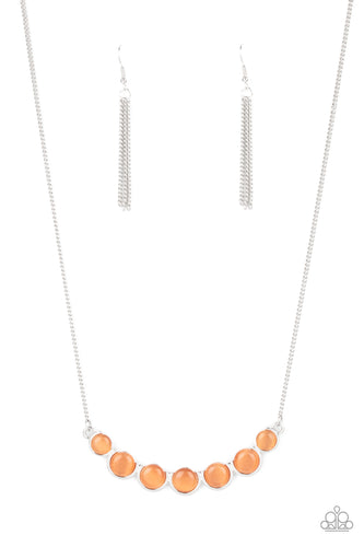 A row of glowing orange cat's eye stones are held in place by a series of interconnected shiny silver frames, creating a whimsically scalloped pendant below the collar. Features an adjustable clasp closure.