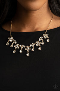 Adorned in glassy white rhinestones, leafy gold frames delicately connect below the collar. Classic white teardrop rhinestones drip from the elegant foliage, adding dazzling movement to the timeless display. Features an adjustable clasp closure. 