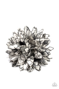 Featuring gray accents, the petals of a bouncy blossom are printed in an abstract geometric pattern for an artsy look. Features a standard hair clip on the back.