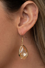 Load image into Gallery viewer, A golden rhinestone gem is threaded along a rod inside a gold teardrop casing, creating a glamorous lure. Earring attaches to a standard fishhook fitting.
