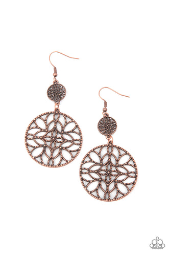 Featuring a stenciled mandala-like pattern, a studded copper frame swings from a dainty matching frame, creating a whimsical lure. Earring attaches to a standard fishhook fitting