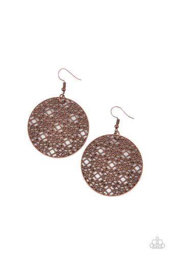 Studded copper filigree fills the inside of a rustic copper hoop, creating an airy mandala pattern. Earring attaches to a standard fishhook fitting.