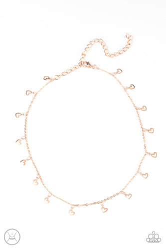 Dainty heart silhouettes swing from a dainty rose gold chain around the neck, creating a flirtatious fringe. Features an adjustable clasp closure. 