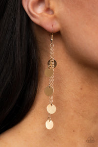 Dainty gold discs haphazardly swing from two dainty gold chains, coalescing into a noisemaking shimmer. Earring attaches to a standard fishhook fitting.