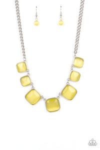 Encased in square silver fittings, a dewy collection of Illuminating cat's eye stones gradually increase in size as they link below the collar for a whimsical pop of color. Features an adjustable clasp closure.
