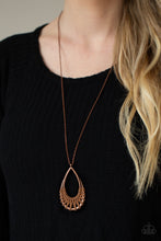 Load image into Gallery viewer,  Brown suede cording loops and weaves around the bottoms of a double stacked copper teardrop frame, creating an earthy pendant at the bottom of a dainty lengthened copper chain. Features an adjustable clasp closure.
