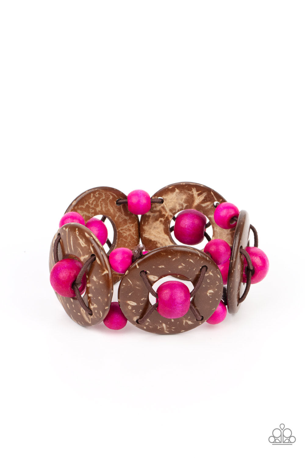 An oversized collection of pink wooden beads and distressed brown wooden discs are threaded along stretchy bands that decoratively weave around the wrist for a summery flair. 