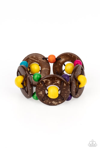 An oversized collection of multicolored beads and distressed brown wooden discs are threaded along stretchy bands that decoratively weave around the wrist for a summery flair. 