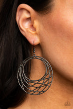 Load image into Gallery viewer, Glistening gunmetal bars crisscross and overlap along the bottom of a circular frame, creating a crescent-like hoop. Earring attaches to a standard fishhook fitting
