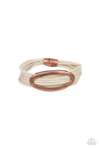 An oval copper fitting glides along strands of rustic white cording, creating colorful layers around the wrist. Features a magnetic closure.