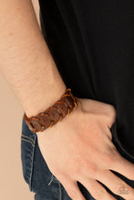 Load image into Gallery viewer, Brown leather laces loop around interconnected leather links, creating a rustic display around the wrist. Features an adjustable snap closure.
