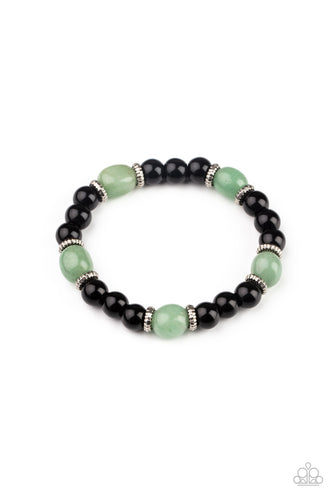 Infused with dainty silver accents, glassy black and green stone beads are threaded along a stretchy band around the wrist for a stackable seasonal look.