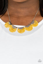 Load image into Gallery viewer, Flecked in shell-like iridescence, yellow acrylic discs are pinched between shiny silver fittings as they link below the collar, creating a colorful fringe. Features an adjustable clasp closure.
