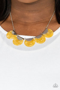 Flecked in shell-like iridescence, yellow acrylic discs are pinched between shiny silver fittings as they link below the collar, creating a colorful fringe. Features an adjustable clasp closure.