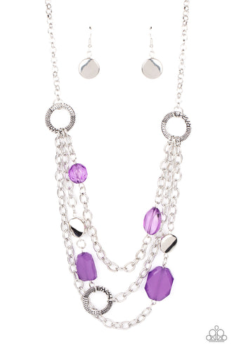 Varying in shape and opacity, glassy purple crystal-like beads, asymmetrical silver discs, and textured silver rings haphazardly adorn three silver chains below the collar for a whimsical pop of color. Features an adjustable clasp closure. 