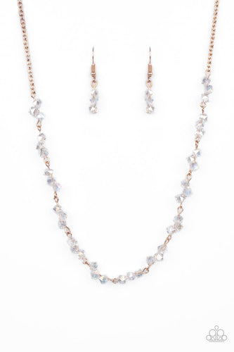 Attached to a dainty rose gold chain, trios of iridescent crystal-like beads are delicately threaded along rose gold rods below the collar for a timelessly twinkly look. Features an adjustable clasp closure.
