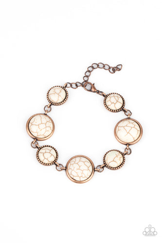 Featuring studded and plain copper frames, small and large white stones delicately alternate around the wrist for a rustic flair. Features an adjustable clasp closure.