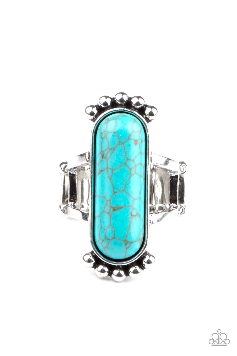An oblong turquoise stone is pressed into a sleek silver frame featuring a studded top and bottom. The rustic frame sits atop two layered bands, creating a whimsical centerpiece atop the finger. Features a stretchy band for a flexible fit. 