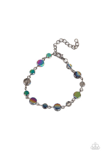 Dipped in an oil spill iridescence, a faceted collection of smoky crystal-like beads delicately links around the wrist for a stellar pop of color. Features an adjustable clasp closure