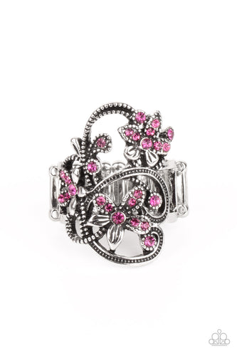 Dotted with dainty pink rhinestone centers, antiqued silver floral frames bloom across a studded backdrop for a sparkly seasonal look. Features a stretchy band for a flexible fit.
