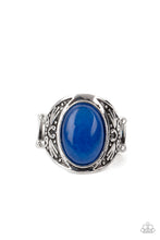 Load image into Gallery viewer, An oversized lapis lazuli stone is pressed into the center of a thick silver frame embossed in antiqued tribal inspired patterns, creating an enchanting centerpiece atop the finger. Features a stretchy band for a flexible fit. 
