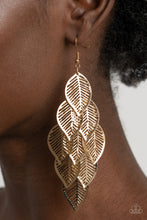 Load image into Gallery viewer, Stenciled gold leaf frames cascade from a gold netted fitting, creating a shimmery leafy fringe. Earring attaches to a standard fishhook fitting. 
