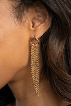 Load image into Gallery viewer, Tapered gold chains cascade from the bottom of a dainty gold hoop, creating an angled fringe. Earring attaches to a standard post fitting.
