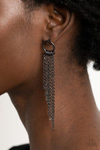 Load image into Gallery viewer, Tapered gunmetal chains cascade from the bottom of a dainty gunmetal hoop, creating an angled fringe. Earring attaches to a standard post fitting.
