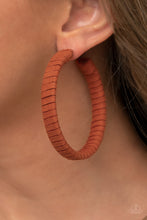 Load image into Gallery viewer, Orange suede cording wraps around an oversized hoop, creating an earthy pop of color. Earring attaches to a standard post fitting. Hoop measures approximately 2 1/4&quot; in diameter.
